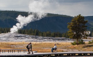 Visitors, including wheelchair user, on wheelchair accessible boardwalk Yellowstone National Park